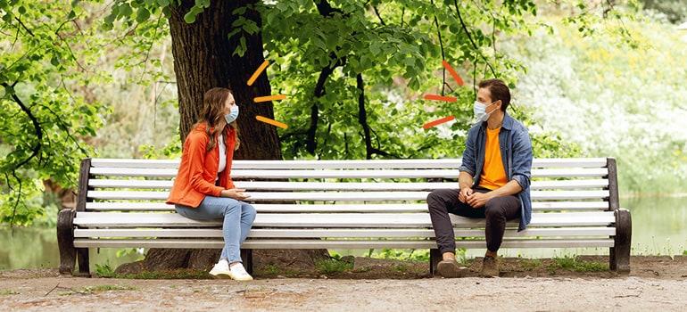 boy and girl chatting on bench