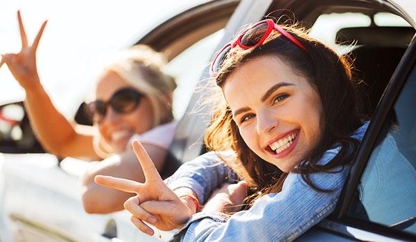 Happy teens in car