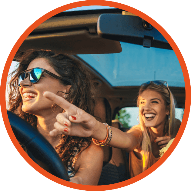 Young girls driving in car