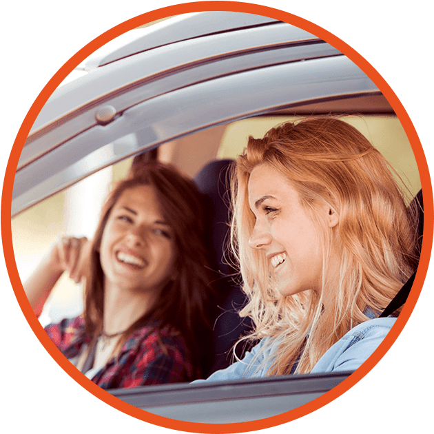 two girls laughing in car