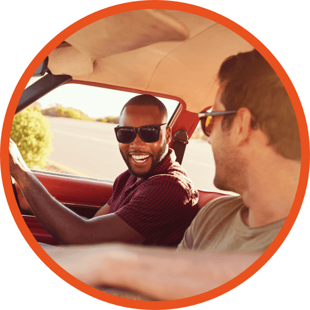 Two guys are driving a car image