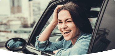 girl leaning out of car window