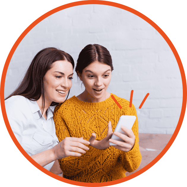 Parent and young adult looking at phone